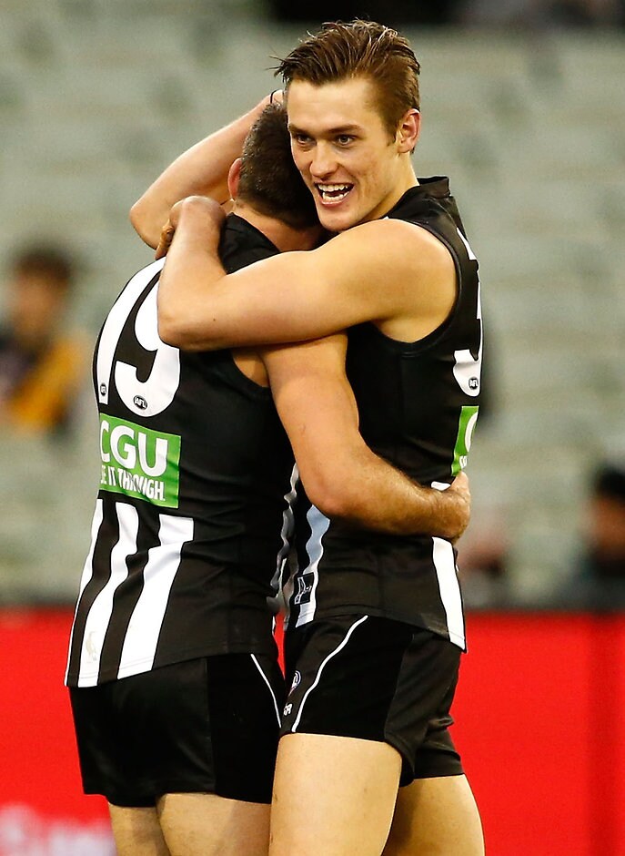 AFL 2016 Rd 19 - Collingwood v West Coast MELBOURNE, AUSTRALIA - JULY 30: Darcy Moore of the Magpies celebrates a goal with Levi Greenwood of the Magpies during the 2016 AFL Round 19 match between the Collingwood Magpies and the West Coast Eagles at the Melbourne Cricket Ground on July 30, 2016 in Melbourne, Australia. (Photo by Adam Trafford/AFL Media)